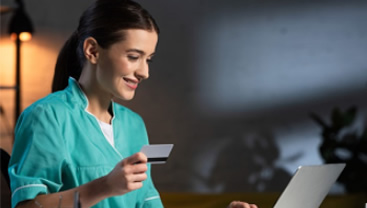 nurse making a purchase on her card